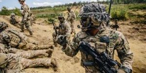 U.S. Army paratroopers assigned to 2nd Battalion, 503rd Infantry Regiment, 173rd Airborne Brigade prepare to run towards a breach while conducting a live-fire exercise in Grafenwoehr Training Area, Germany.