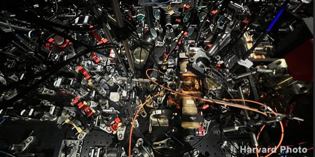 Overhead view of Harvard experiment funded by DARPA’s ONISQ program, featuring optical paths for a novel, reconfigurable quantum computing architecture (source: https://www.darpa.mil/DDM_Gallery/overhead%20619x316%20copy.jpg).